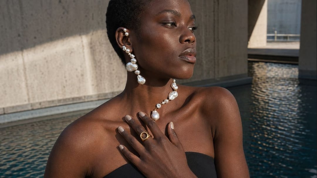 pearl jewelry with baroque pearl necklace creamy nails and silver rings for spring