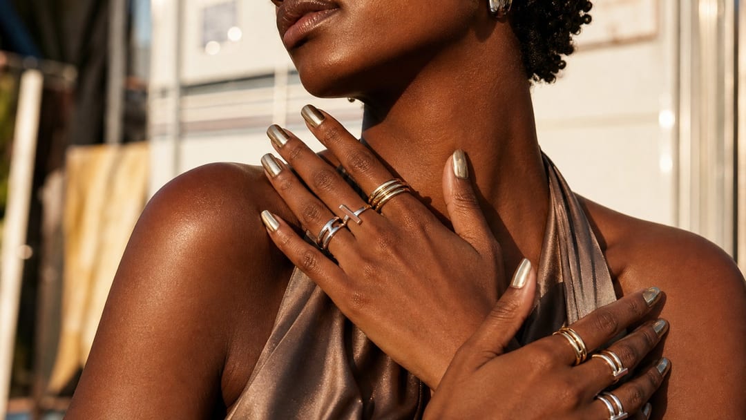 festival nails and jewelry styled as wearable sculpture under summer concert light
