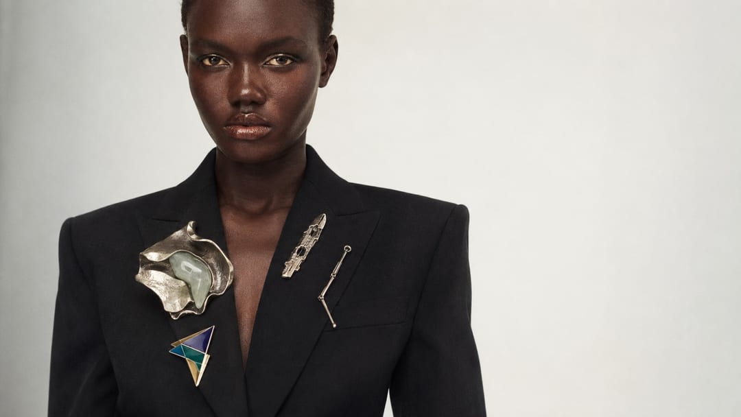 merch culture semiotics — a model wearing layered symbols that don’t agree