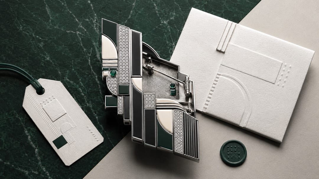 supply chain and symbolic meaning — a receipt, an origin label, and a sculptural brooch