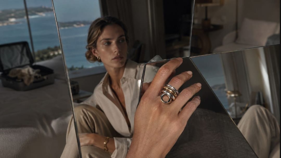 travel style psychology shown through a hotel drawer with nails, jewelry, and a cobalt Room Key object
