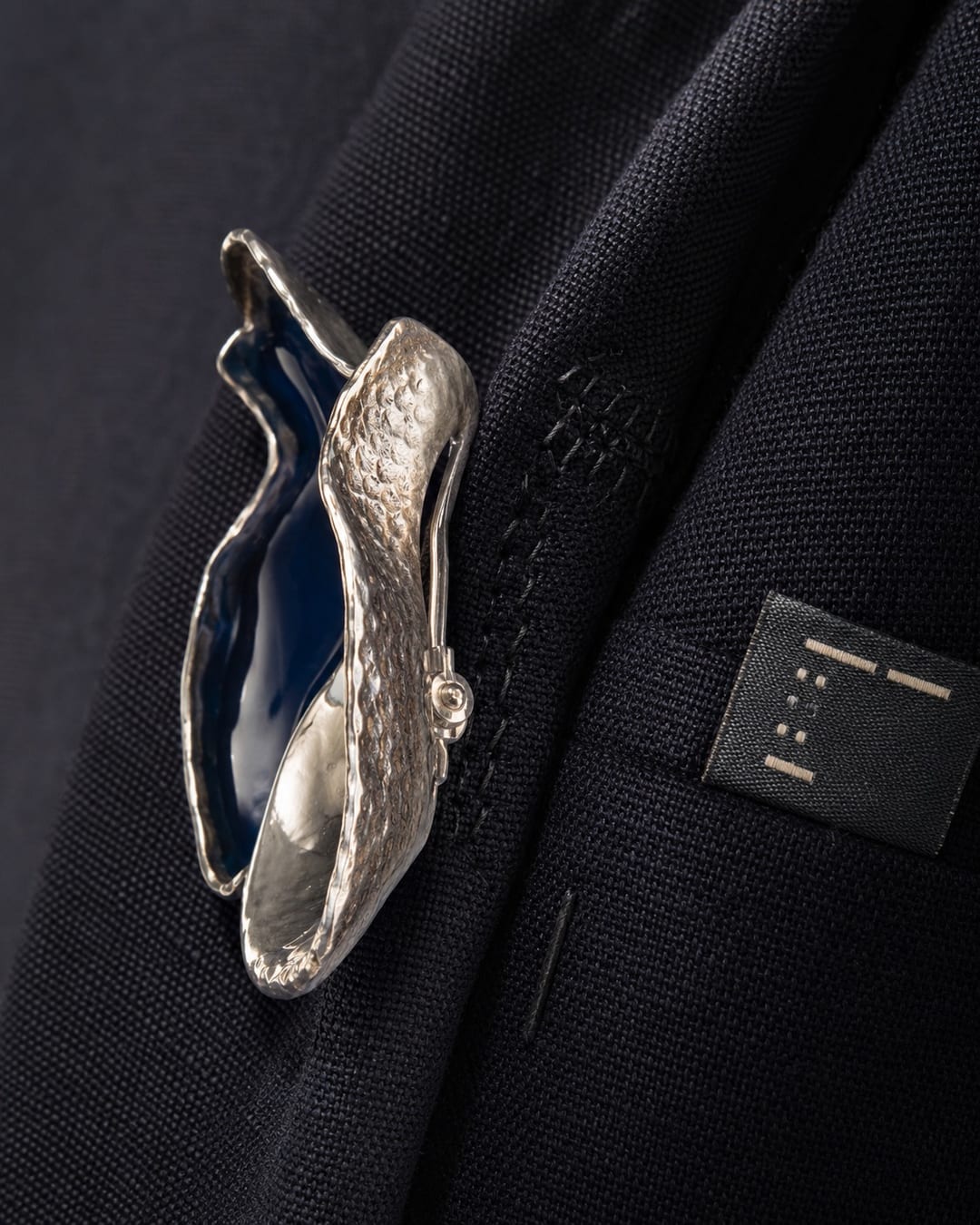symbol failure merchandise — close-up of “Made in” label and quality stitching